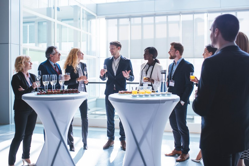 Delegates networking between sessions at a professional conference